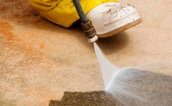 High pressure water cleaning concrete surface — GleamClean pressure washing Perth.